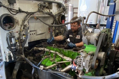 Consolidated Truck technician doing engine work on a big truck. Concept image of ‘Don’t Jump to the Wrong Conclusion! Make Sure You Get Truck Diagnostics Right” | Consolidated Truck Parts & Service in Monroe, LA.