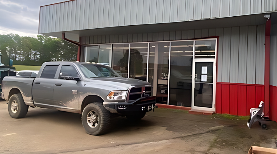 Truck inspection in Many, LA at Consolidated Truck Parts & Service. Image of a black truck parked outside the Consolidated Truck garage in Many, ready for a thorough inspection.