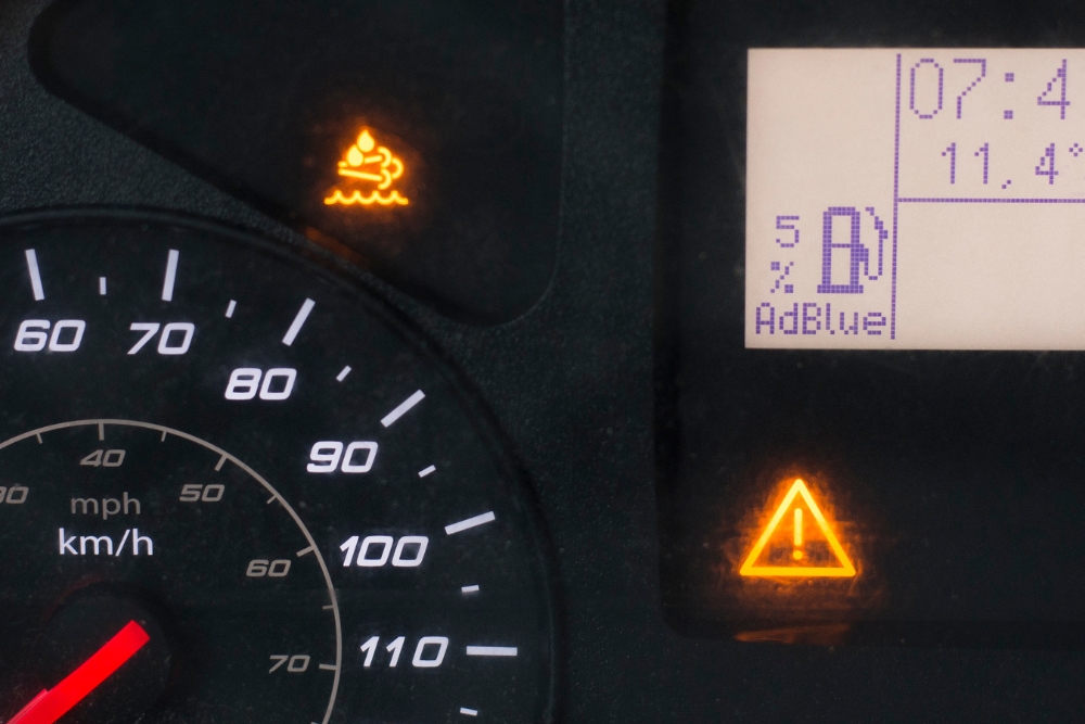DEF System Repair Many, LA At Consolidated Truck. Truck dashboard showing AdBlue/DEF level at 5% with warning indicator – highlighting DEF system status for truck maintenance.